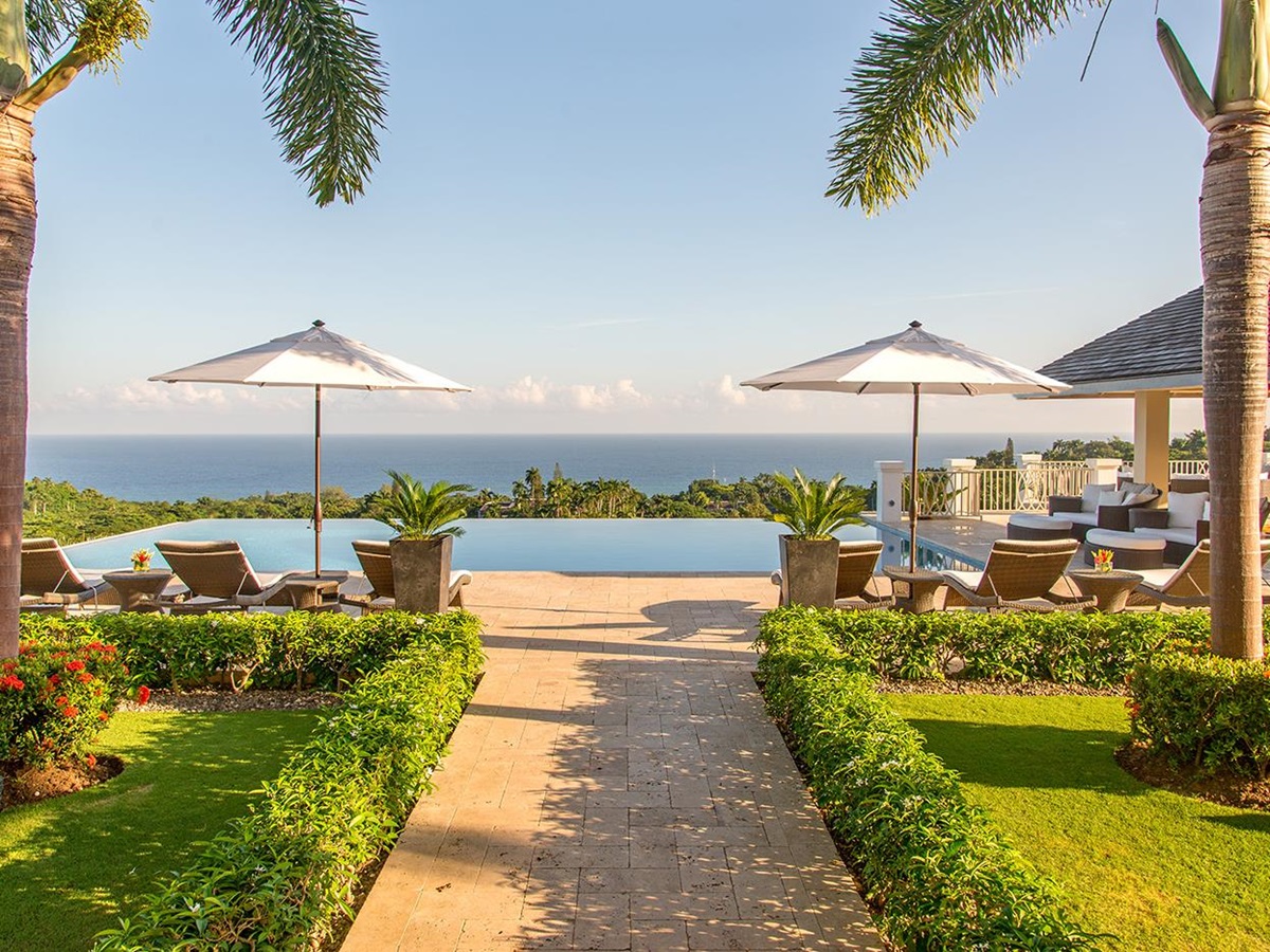The gardens and pool in the distance at Harmony Hill in Jamaica