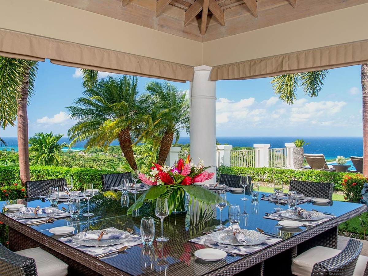 Outdoor dining with sea views at Harmony Hill in Jamaica