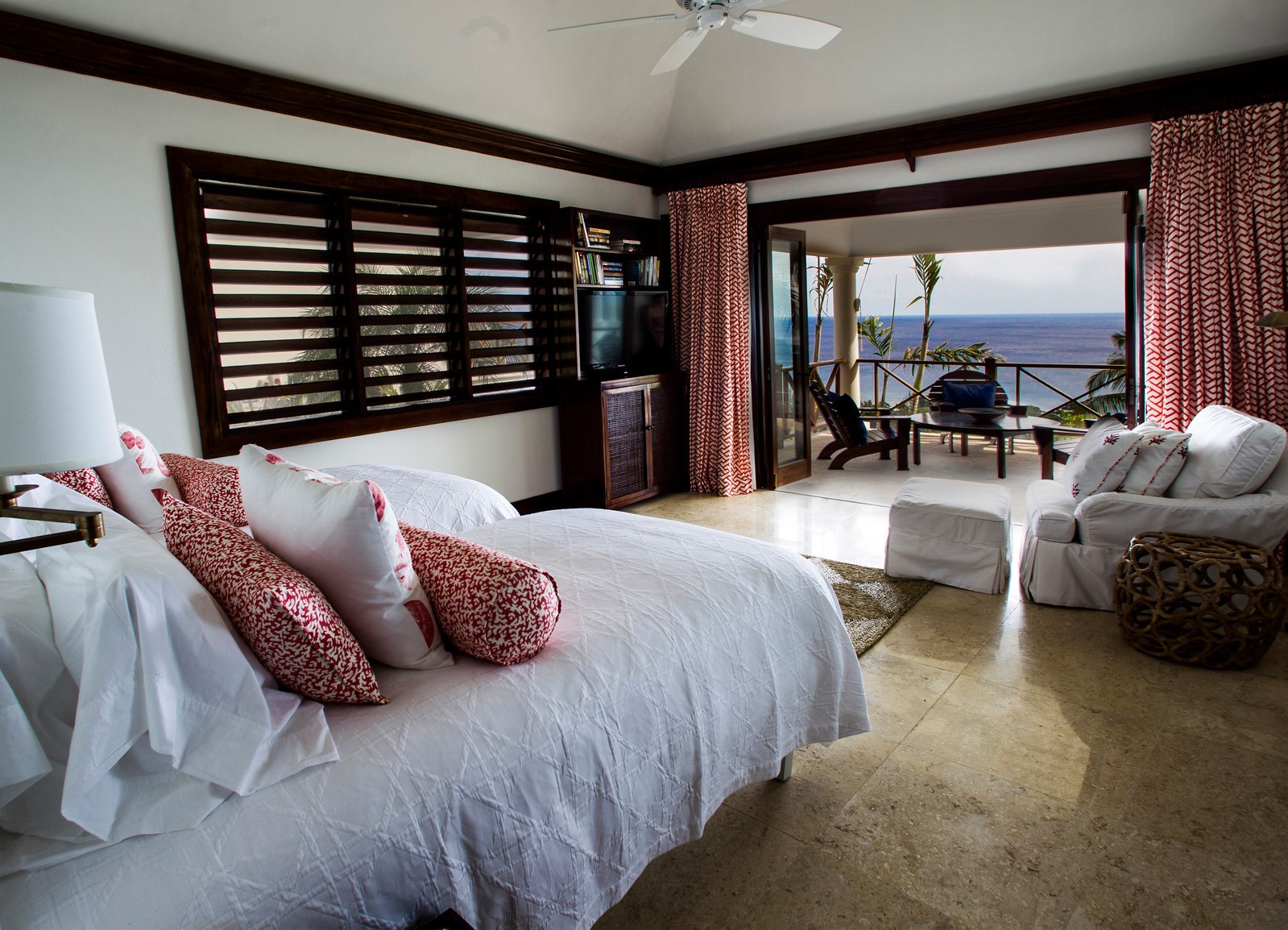 Double bedroom with access to outdoor terrace at Hummingbird House, Jamaica
