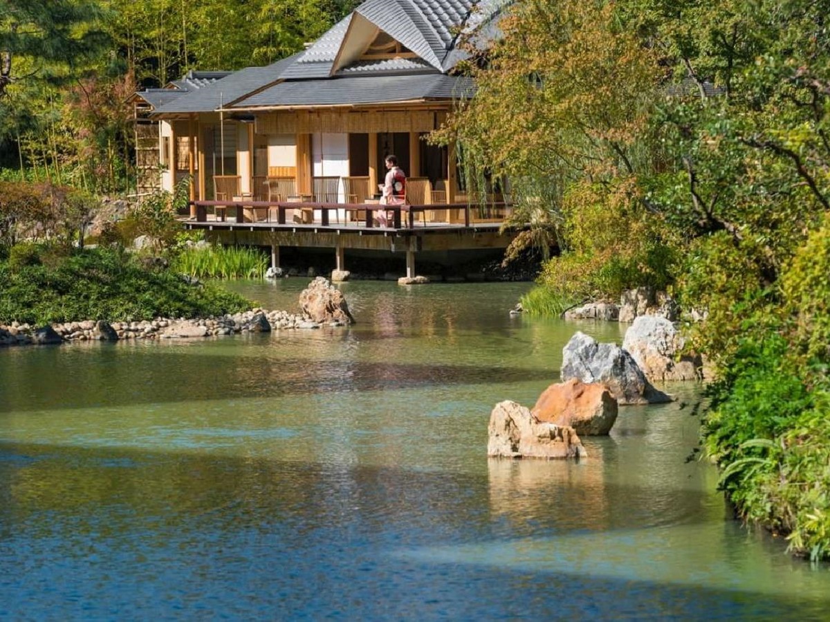Lake and tea house at the Four Seasons Kyoto in Japan