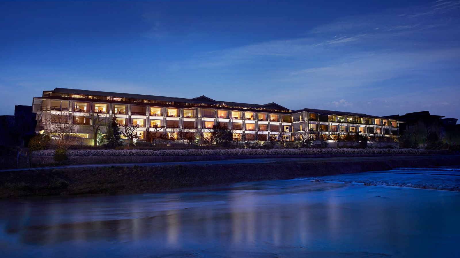 Night view of the riverfront Ritz Carlton Kyoto hotel in Japan