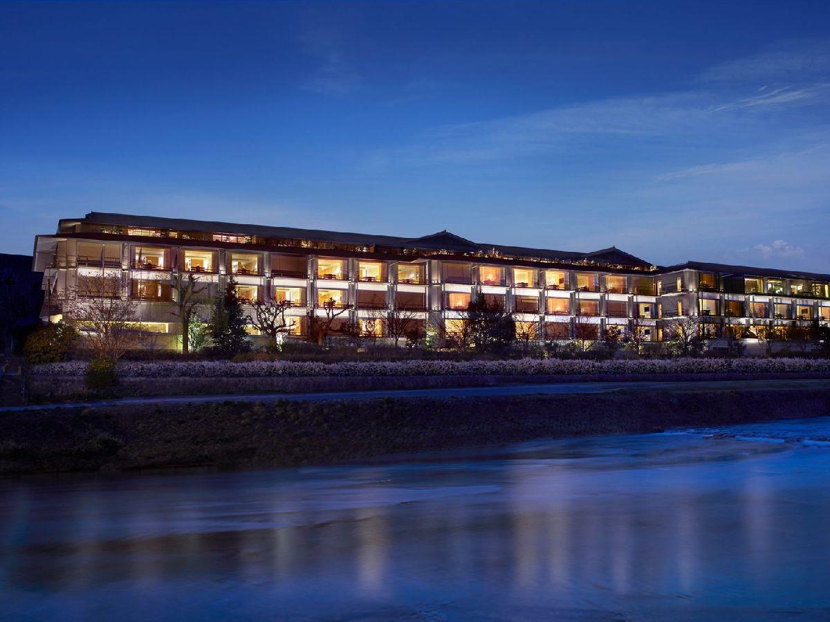 Night view of the riverfront Ritz Carlton Kyoto hotel in Japan