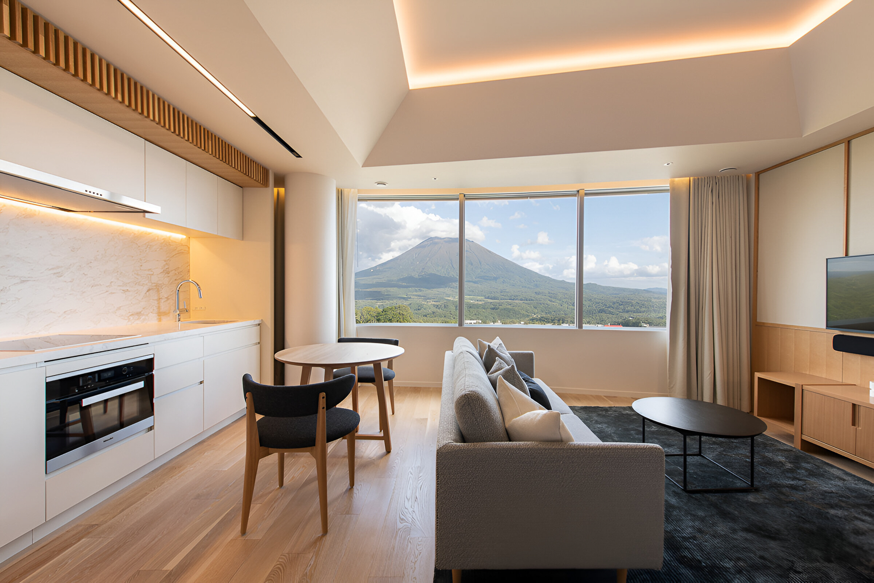 Lounge with fireplace at Skye Niseko ski hotel in Japan