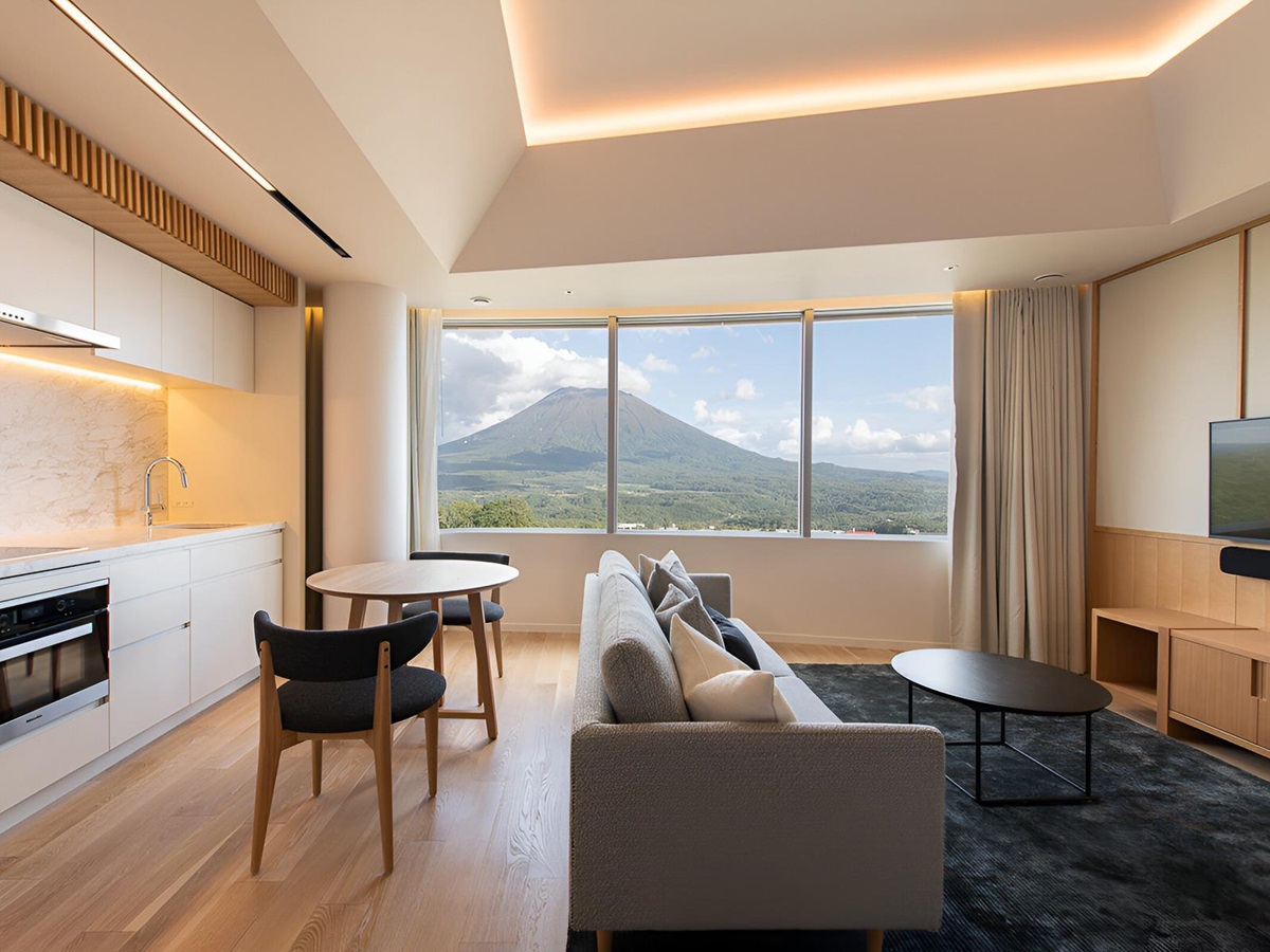 Lounge with fireplace at Skye Niseko ski hotel in Japan