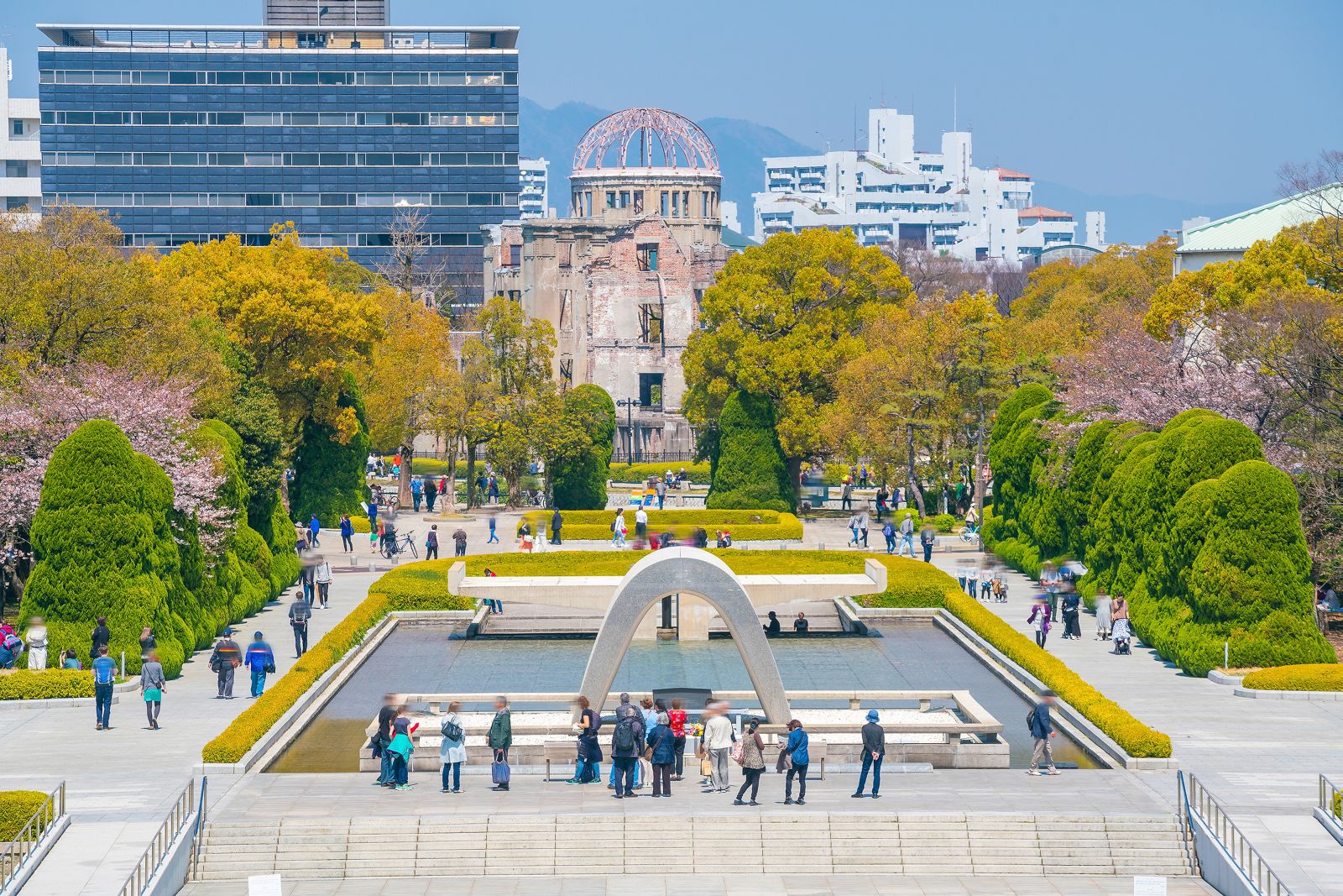People walking around Hiroshima Peace Memorial Park in Japan