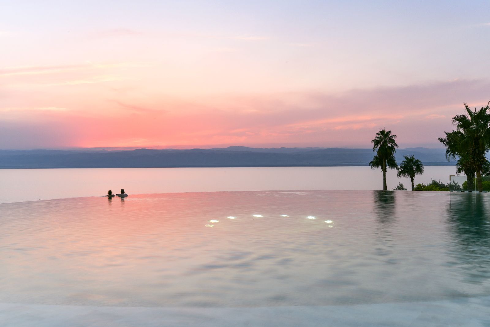 The infinity pool at sunset at the Kempinski Ishtar Dead Sea in Jordan