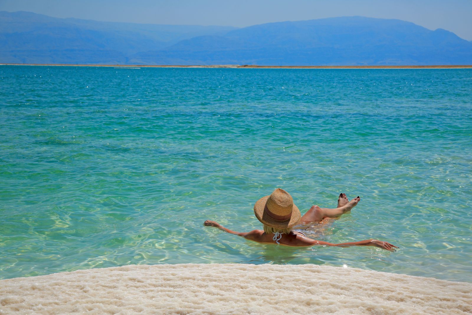Tourist floating in the Dead Sea in Jordan