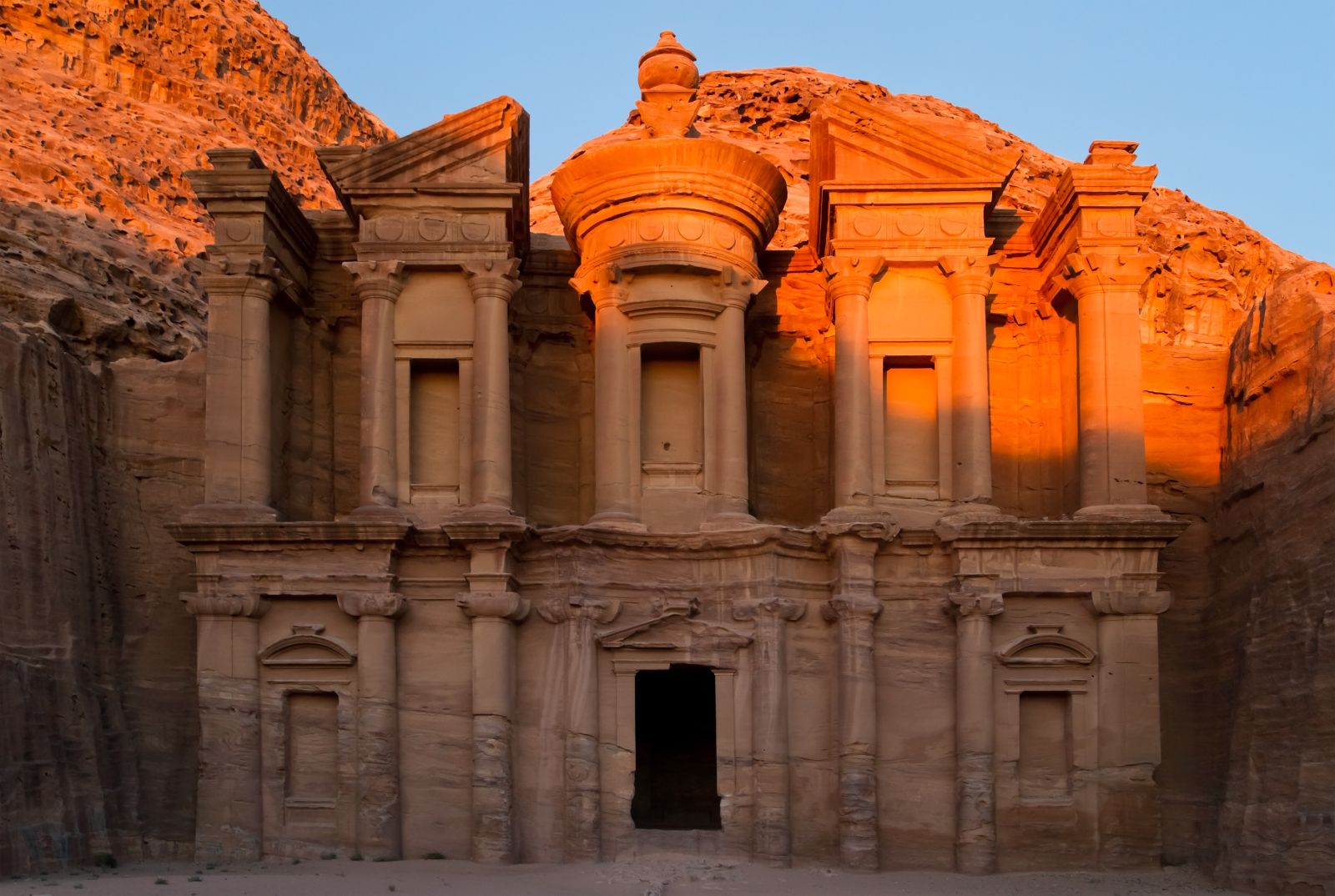 The sun rising over the Monastery at Petra in Jordan