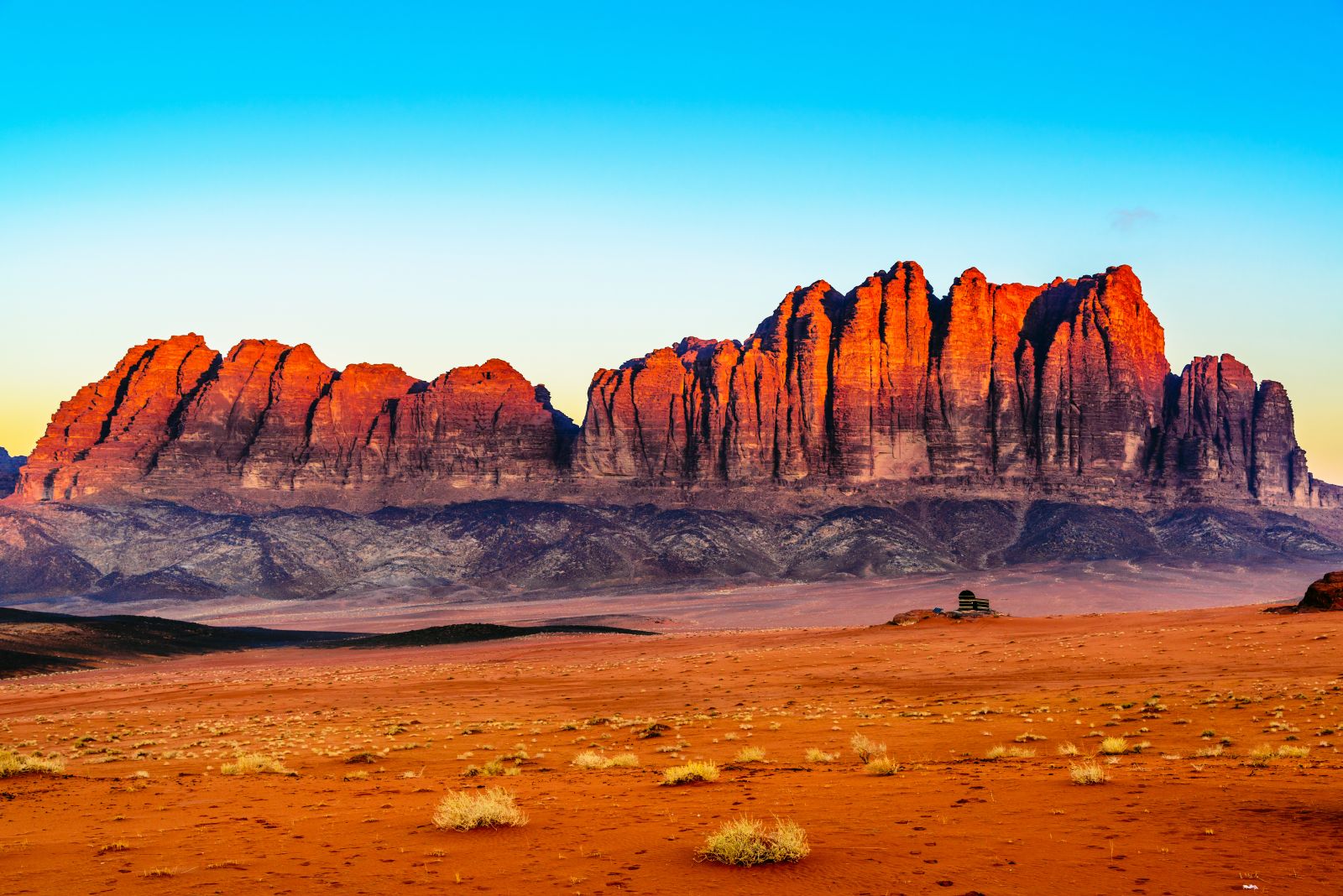 Panorama of the red sand and red cliffs of Wadi Rum in Jordan
