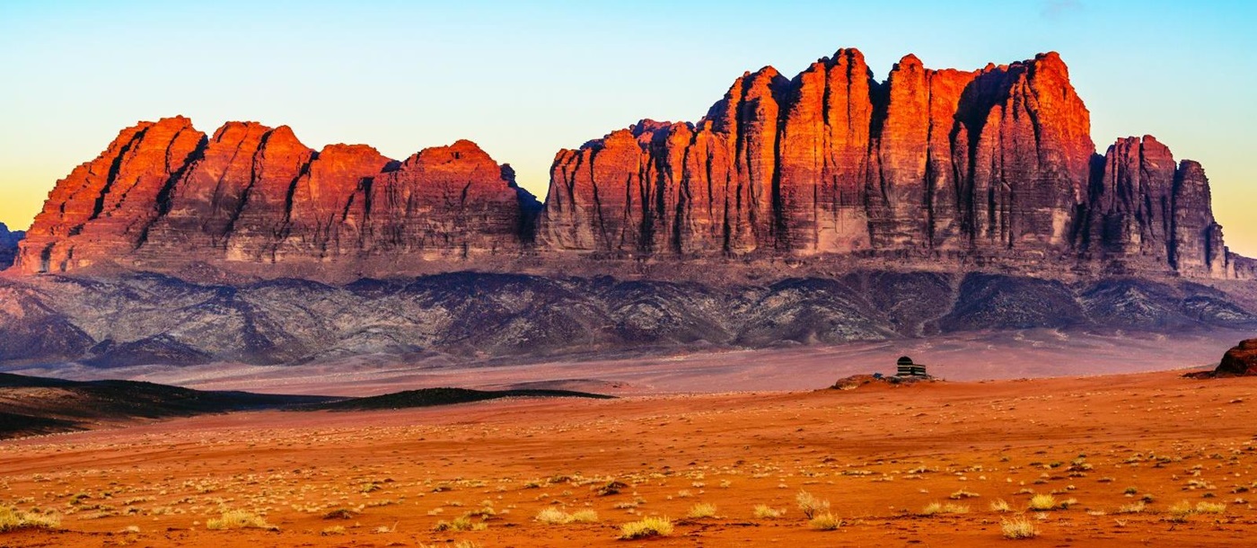 Panorama of the red sand and red cliffs of Wadi Rum in Jordan