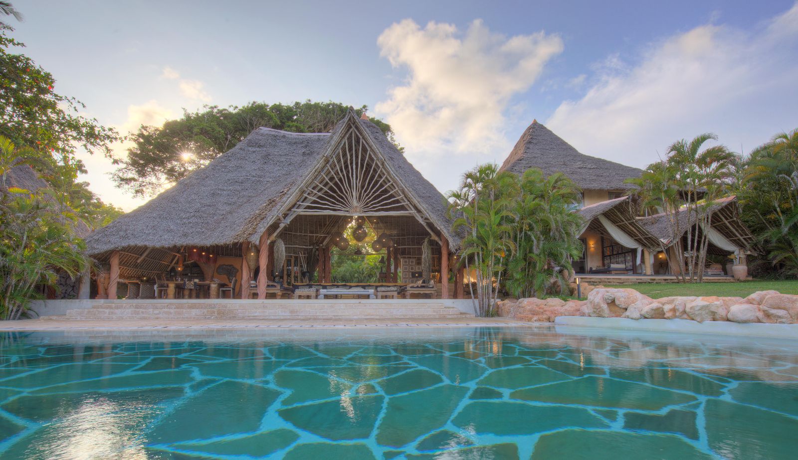 Garden Villa pool and exterior of building at Alfajiri Vilas on Diani Beach in Kenya