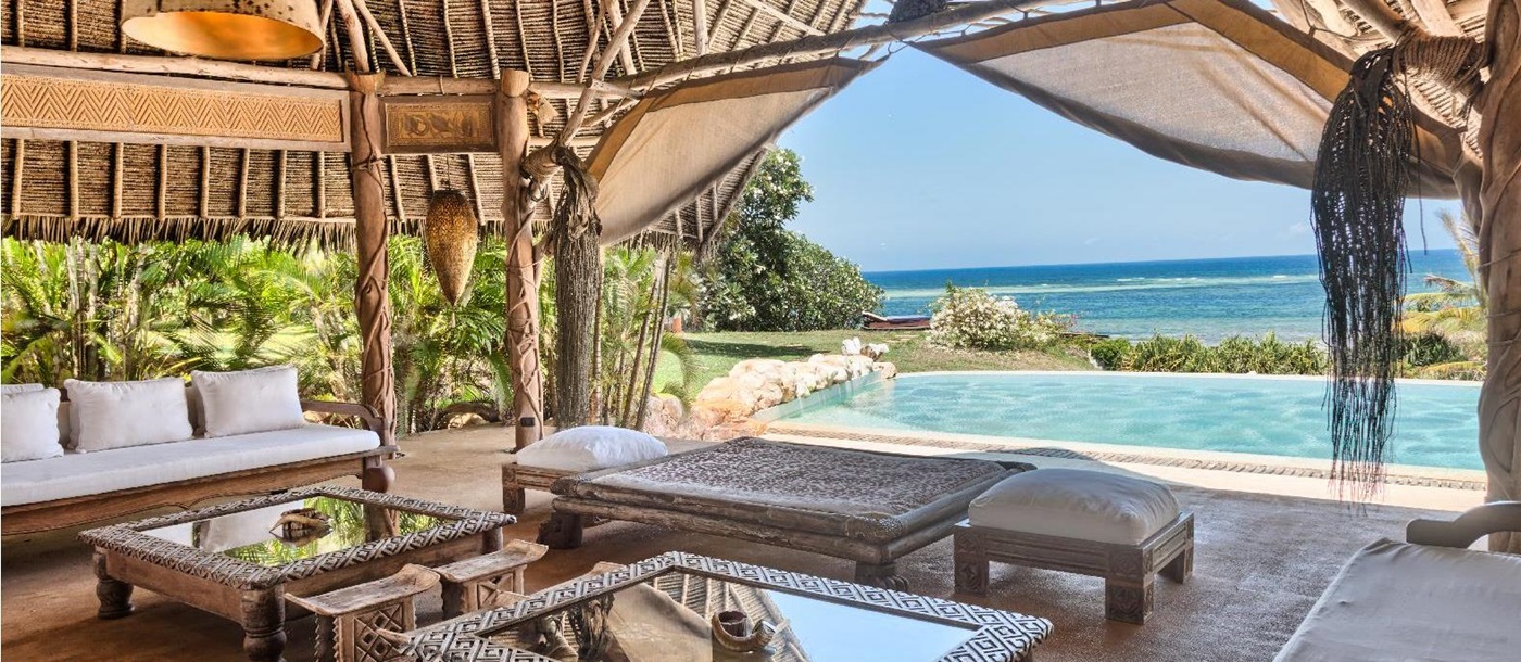the living room and pool of the garden villa at Alfajiri, Kenya