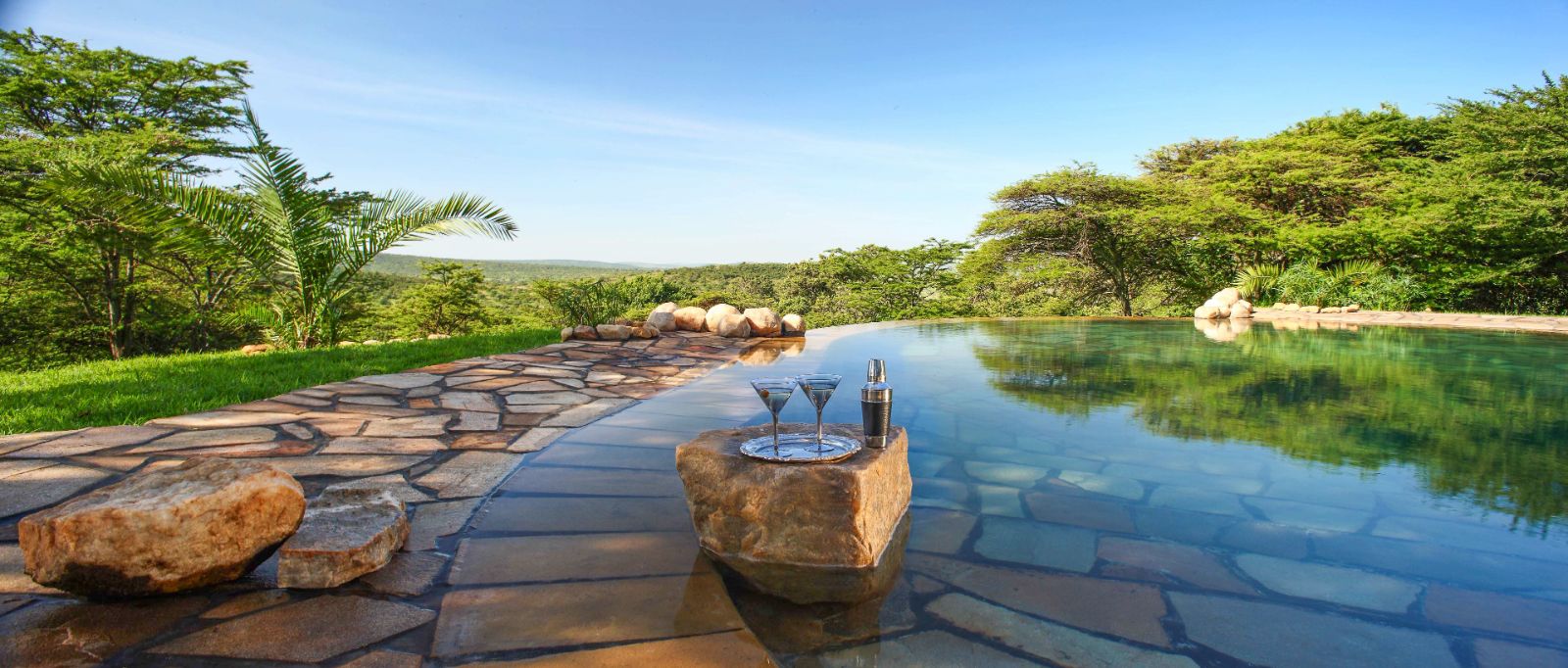 Drinks served by the swimming pool at Cottars 1920s Camp in the Maasai Mara