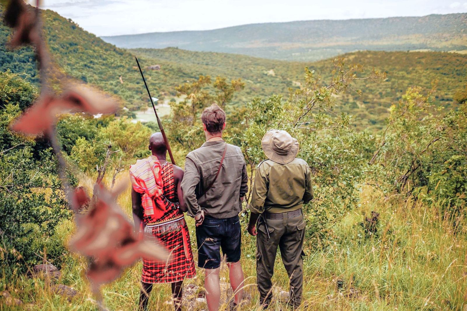 Trekking with a local Maasai warrior from Cottars 1920s Camp in the Maasai Mara
