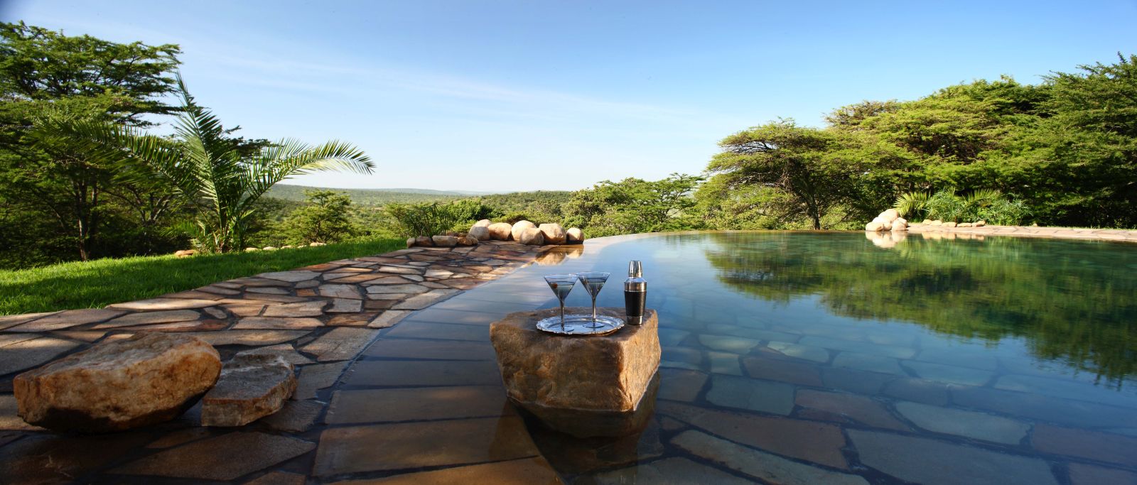 Cocktails by the pool at Cottars 1920s Camp in Kenya
