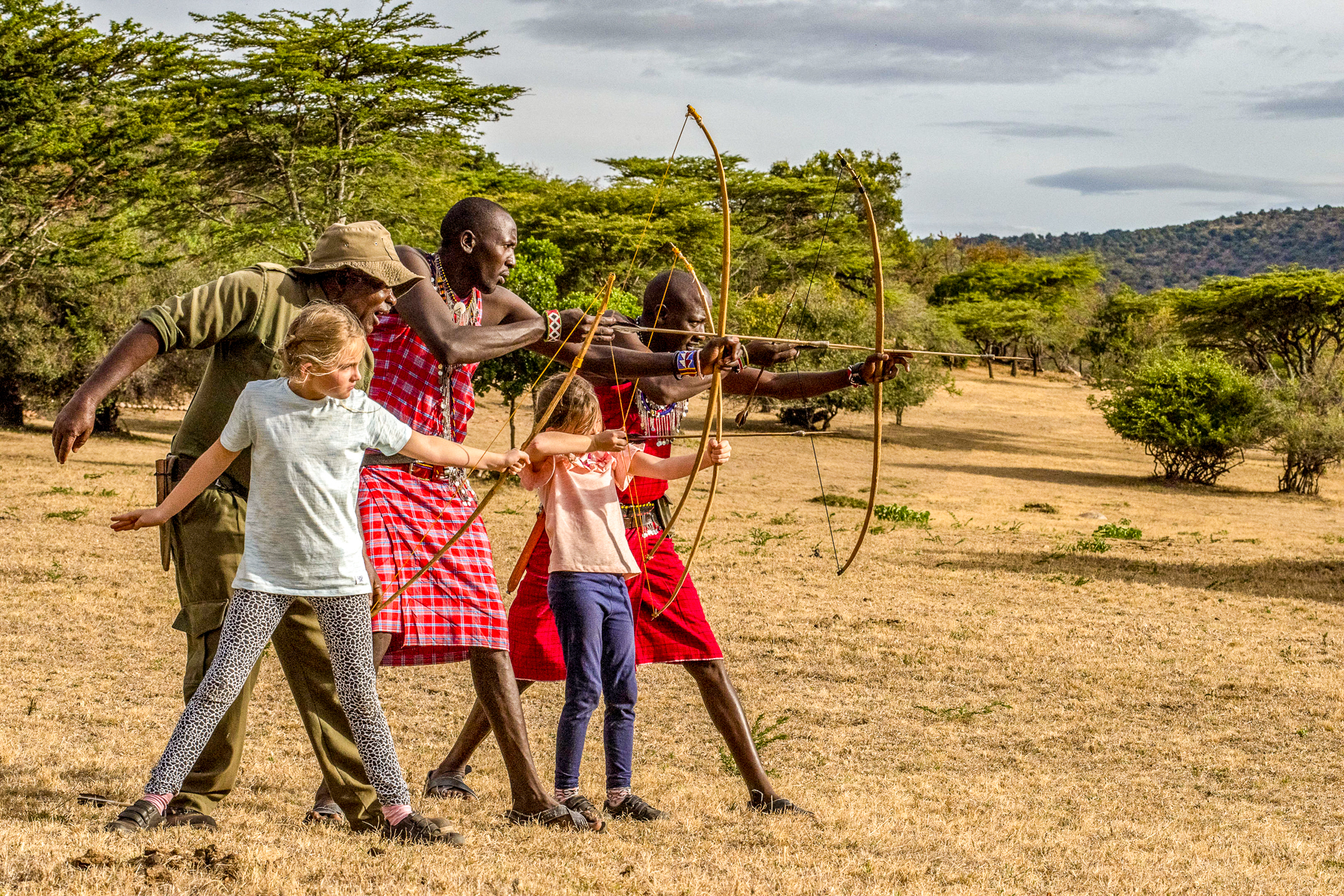 Children during an archery lesson at Cottar's 1920s Camp in the Masai Mara