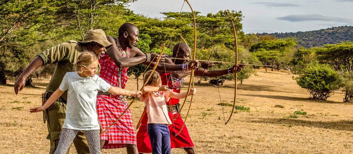 Children during an archery lesson at Cottar's 1920s Camp in the Masai Mara