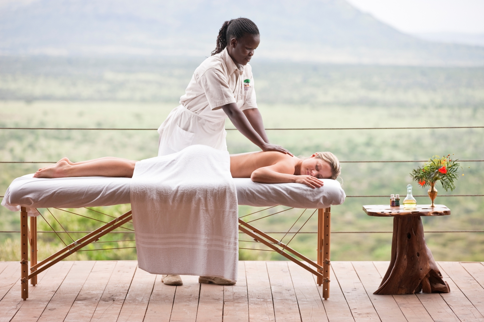 A woman receiving a massage at Cottars 1920s Camp in the Masai Mara