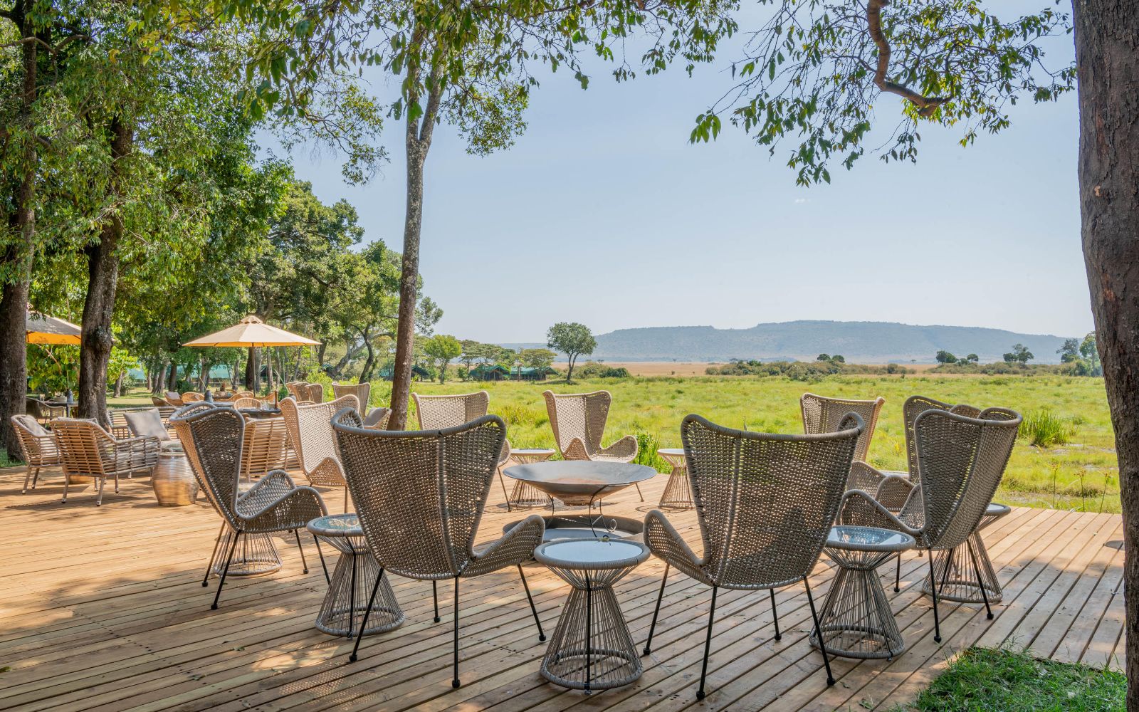 Outdoor seating and campfire at Little Governors Camp, Kenya