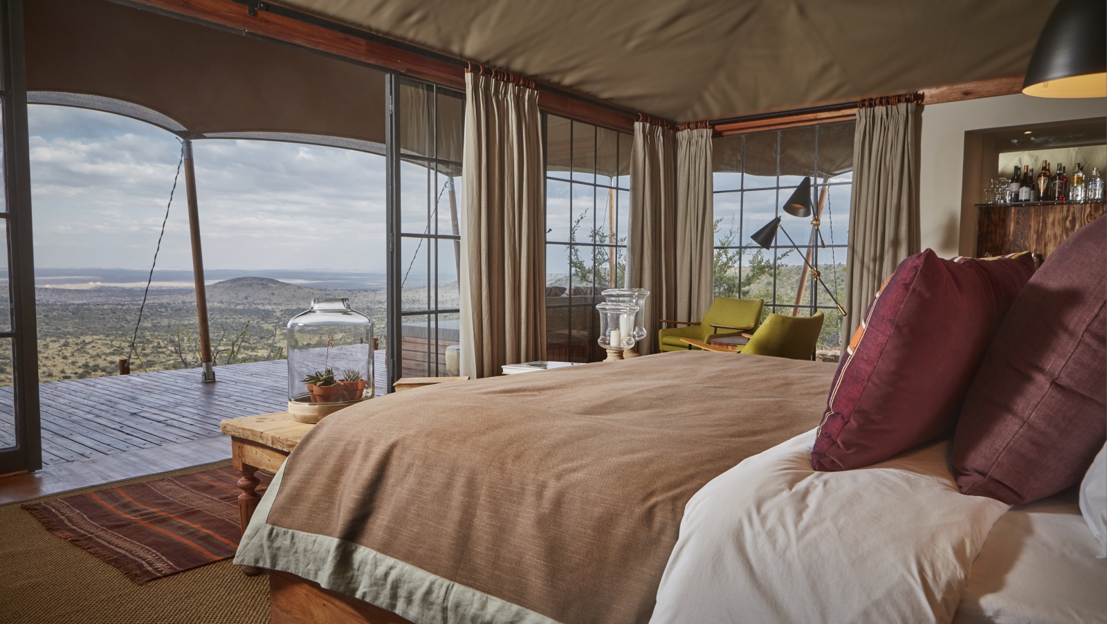 Double tented room with private verandah at luxury safari lodge Lodo Springs in the Laikipia region of Kenya