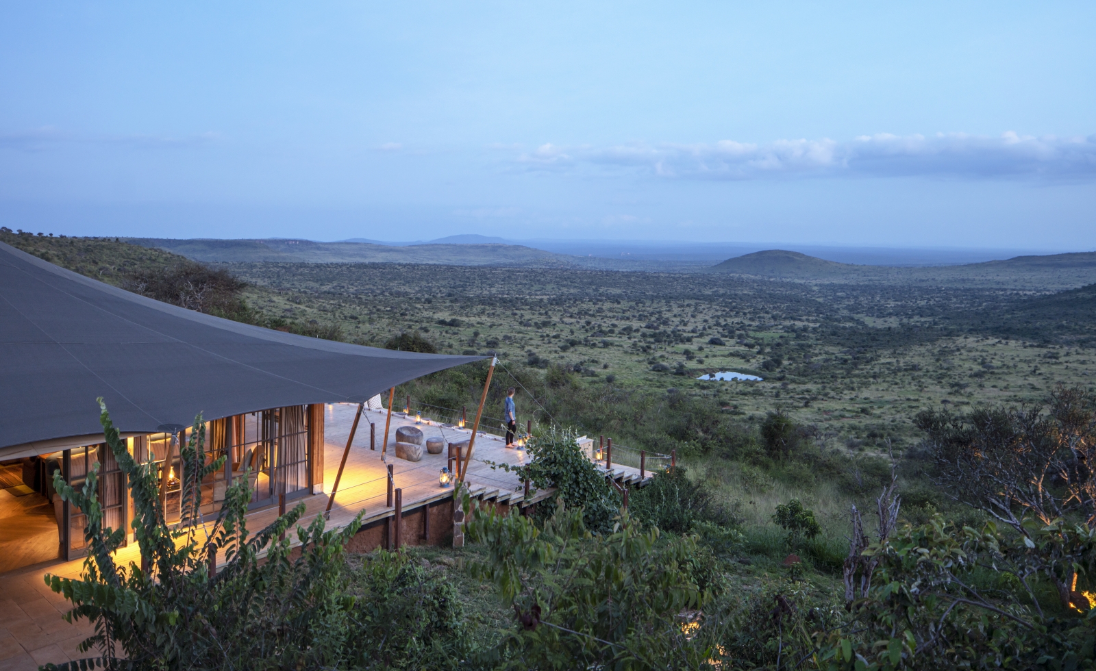Aerial shot of a luxury tented room and the surrounding bushveld at luxury safari lodge Lodo Springs in the Laikipia region of Kenya