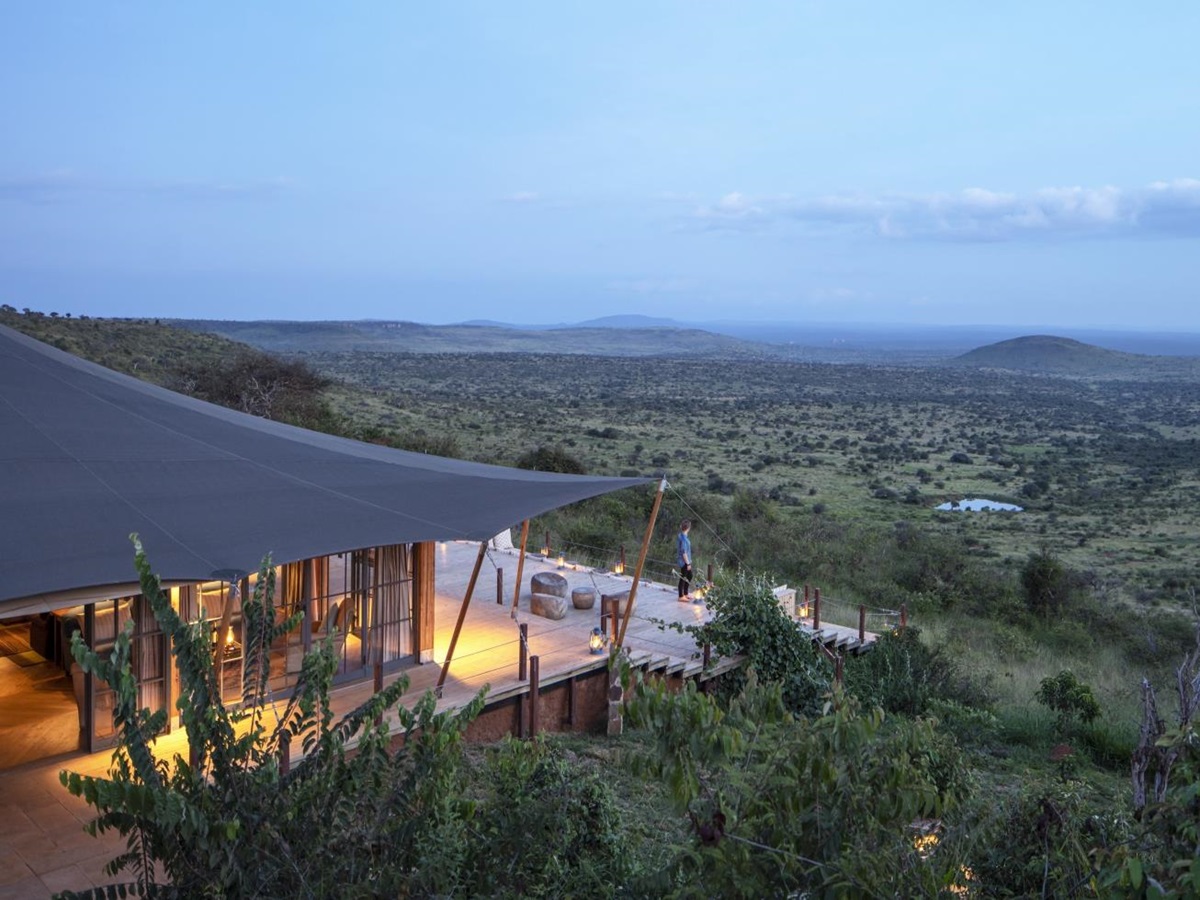 Aerial shot of a luxury tented room and the surrounding bushveld at luxury safari lodge Lodo Springs in the Laikipia region of Kenya