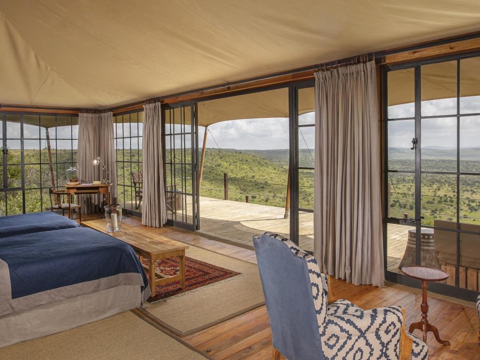 Luxury twin tented room with private verandah and sitting area at luxury safari lodge Lodo Springs in the Laikipia region of Kenya