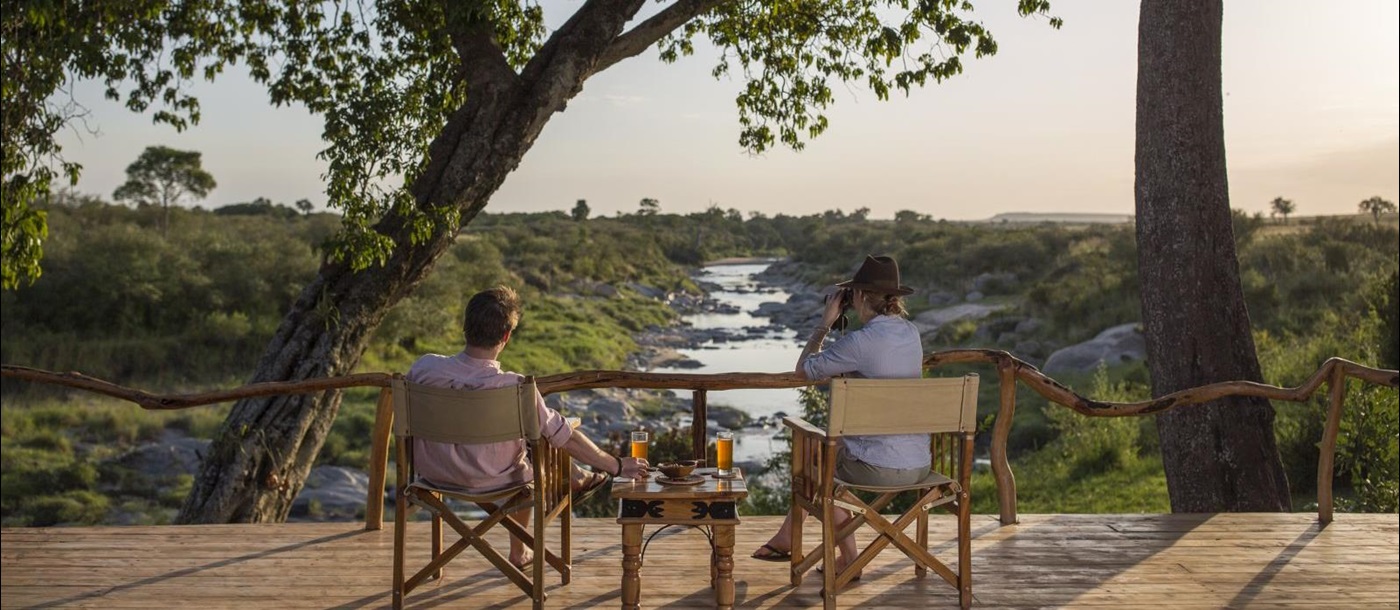 Drinks overlooking the river at Rekero Camo in Kenya 