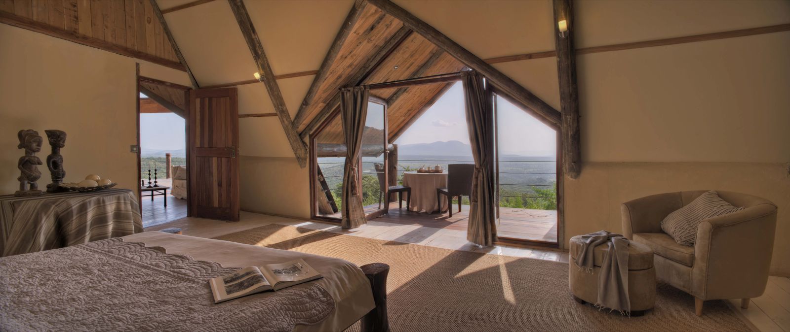 Guest room and terrace at Cottar's Bush Villa in the Maasai Mara Kenya