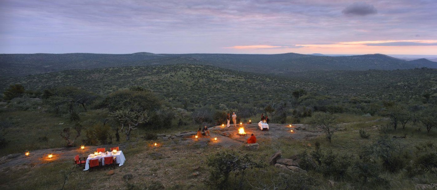 Candlelit outdoor dining at The Sanctuary at Ol Lentille Kenya