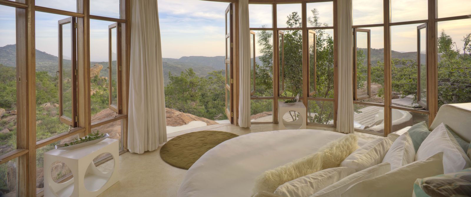 Guest room with panoramic views at The Sanctuary at Ol Lentille Kenya