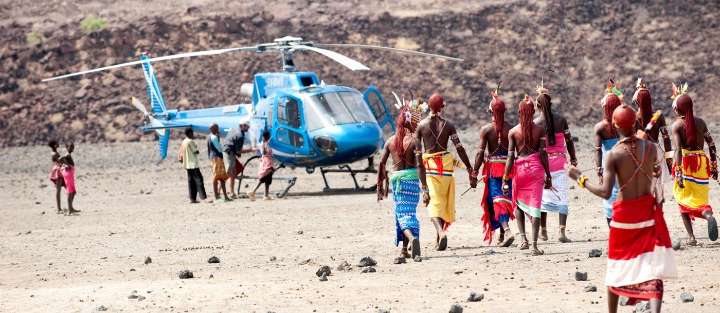Kenyans coming to greet visting helicopter