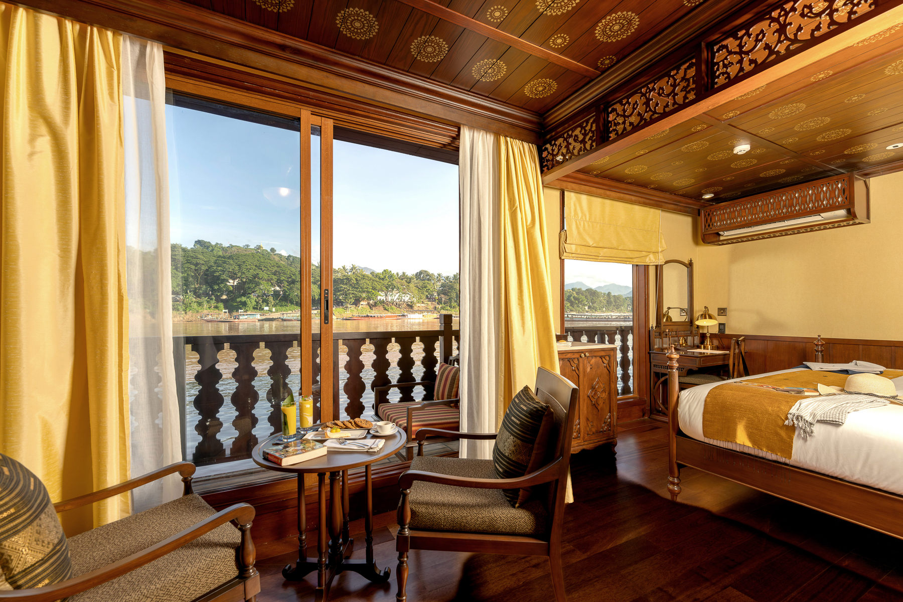 Views of the Upper Mekong from a Signature Suite onboard the Anouvong luxury river cruiser in Laos