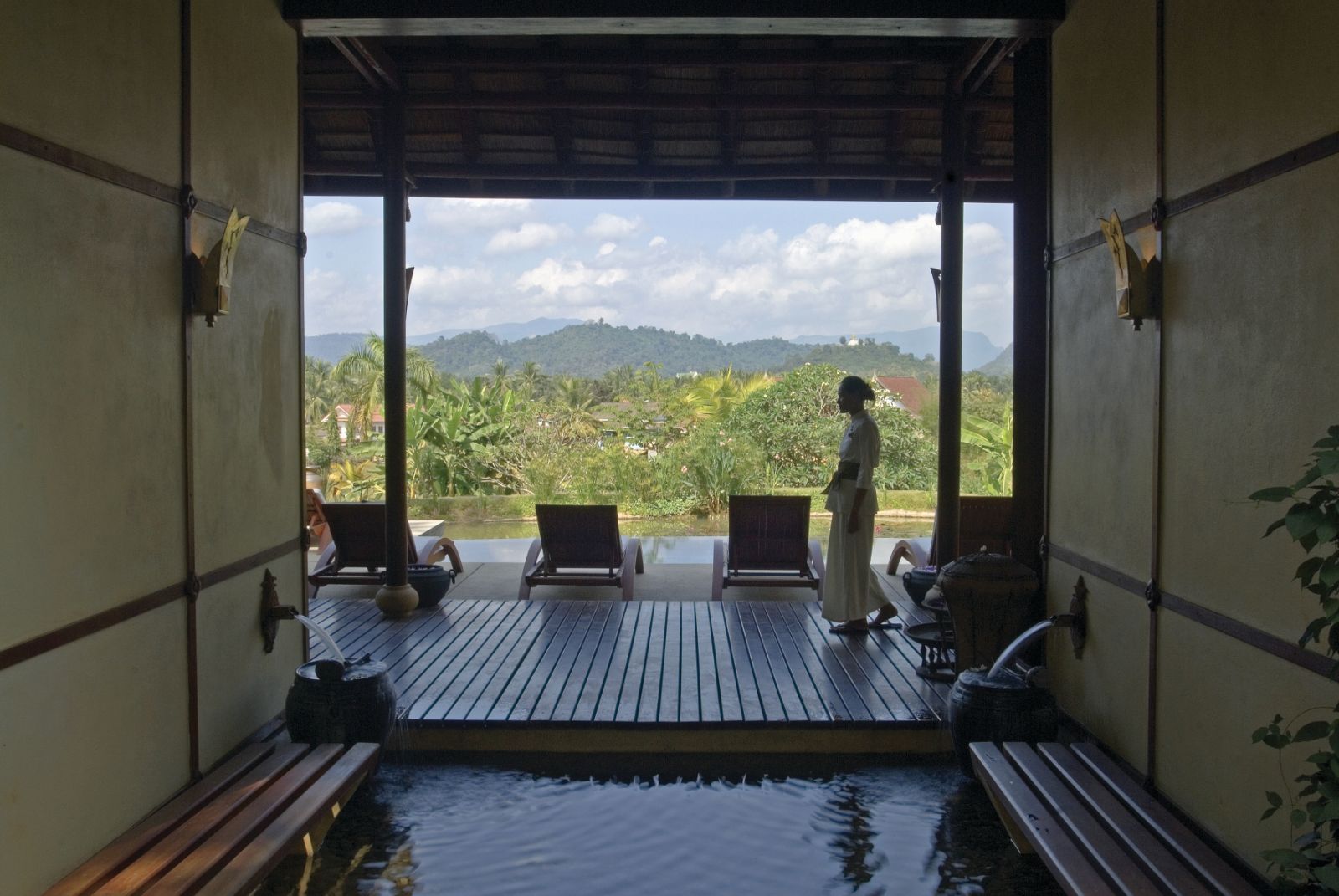 Plunge pool and sunbeds with view of grounds of La Residence Phao Vao in Luang Prabang, Laos