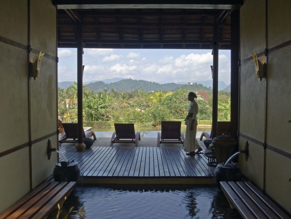 Plunge pool and sunbeds with view of grounds of La Residence Phao Vao in Luang Prabang, Laos