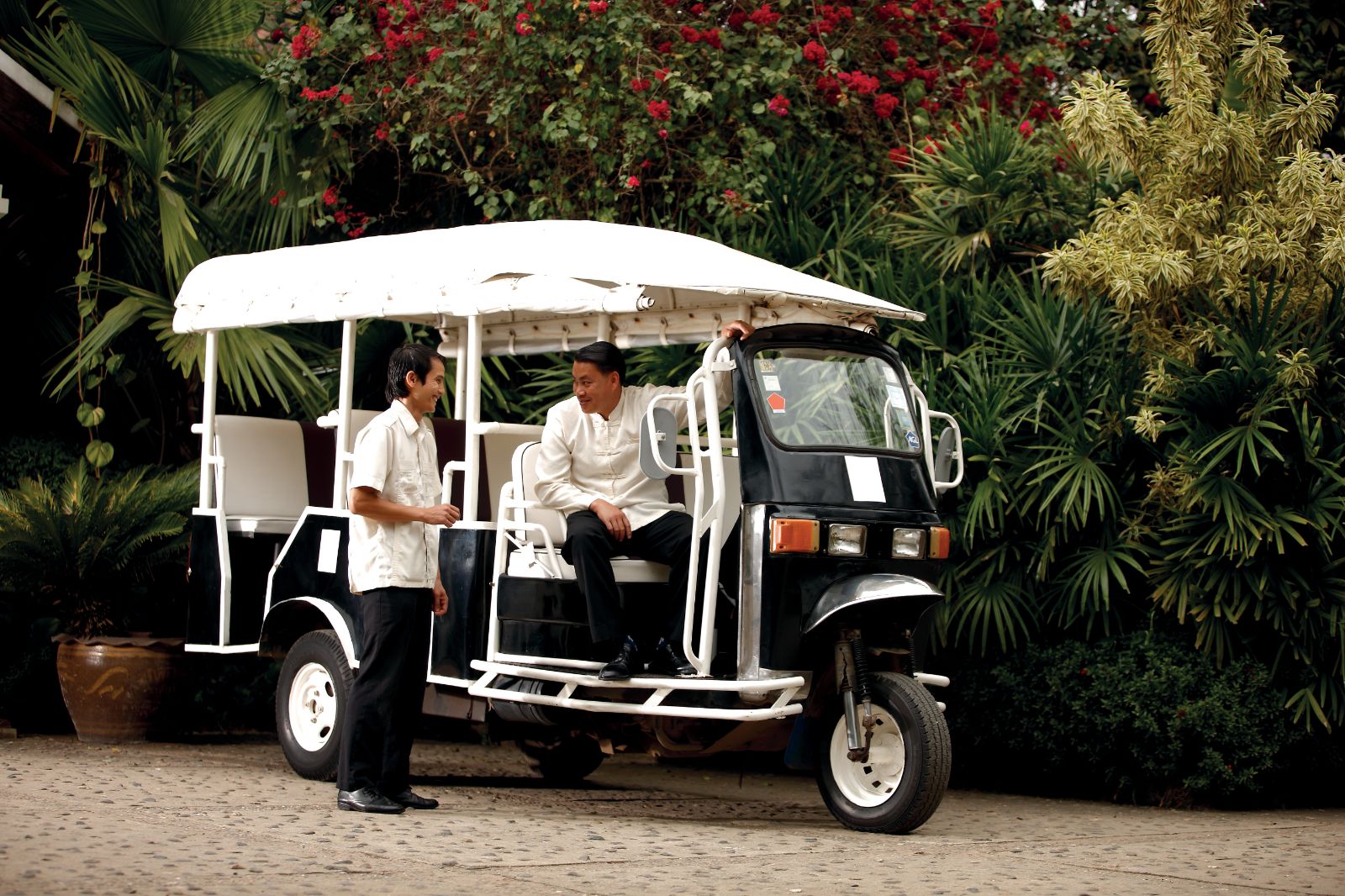 A tuk tuk on the grounds of La Residence Phao Vao in Luang Prabang, Laos