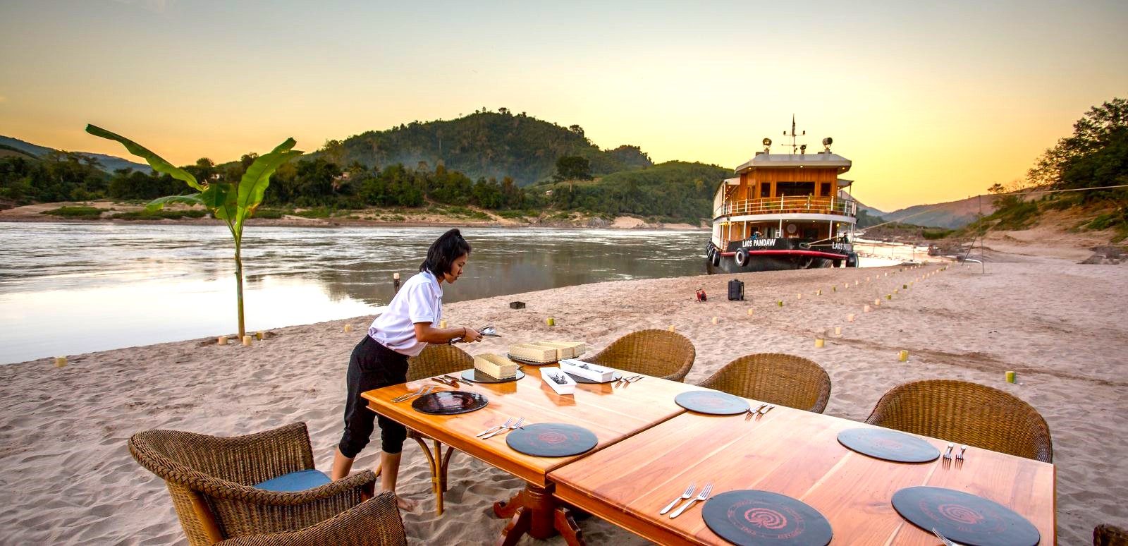 Beach dining from the RV Laos Pandaw on the Mekong River in Laos