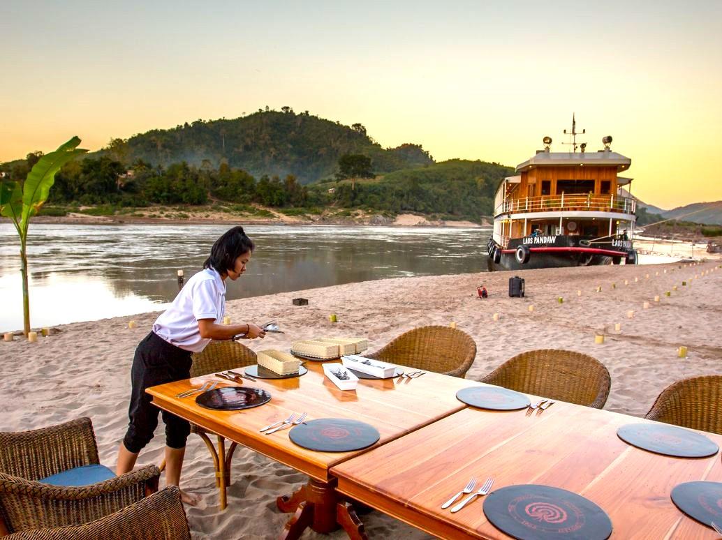 Beach dining from the RV Laos Pandaw on the Mekong River in Laos
