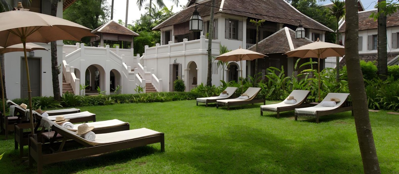 Sunbeds in the gardens of Satri House in Luang Prabang, Laos