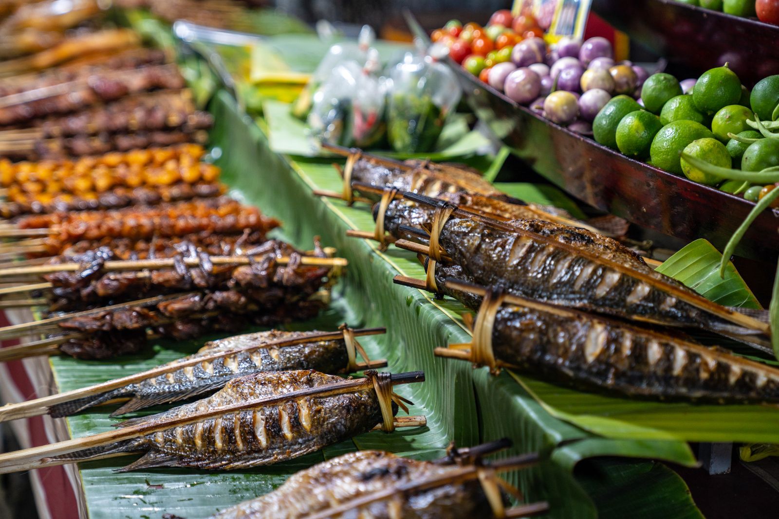 Freshly grilled fish on a street food stall in Laos