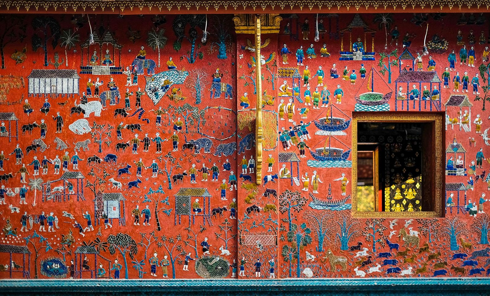 Colourful glass mosaic detail of the Wat Xieng Thong Temple in Luang Prabang, Laos
