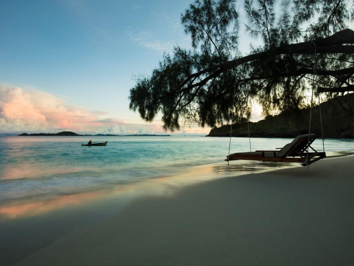 Swinging lounger on the beach at dusk at the Constance Tsarabanjina island resort in Madagascar