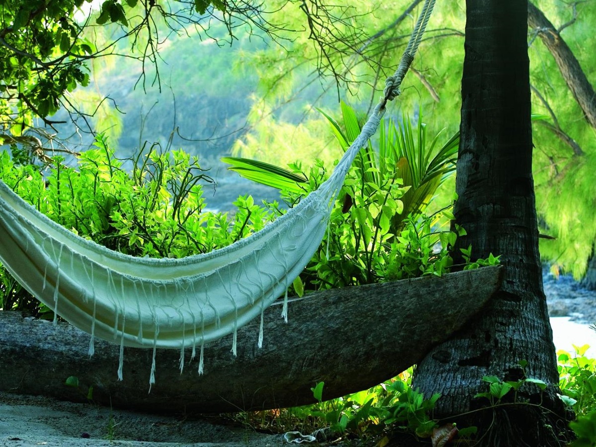 Beach hammock surrounded by tropical forest at the Constance Tsarabanjina in Madagascar
