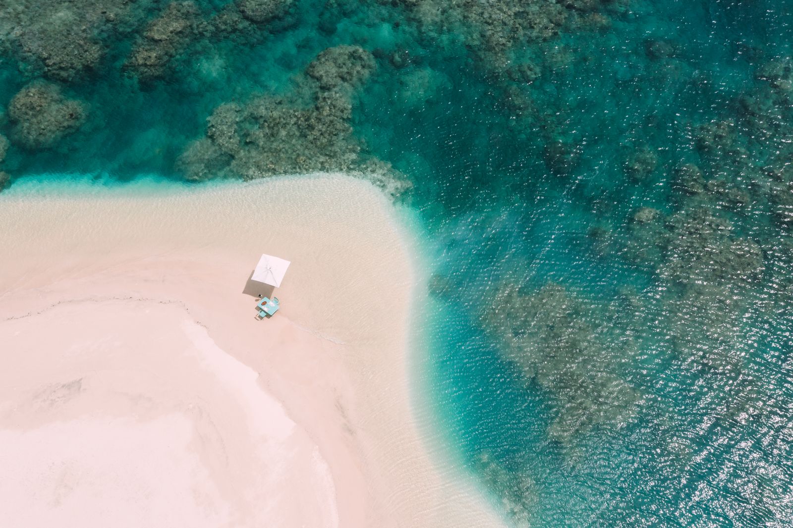 Aerial view of dining on the beach at Miavana private island resort in off Madagascar's north coast