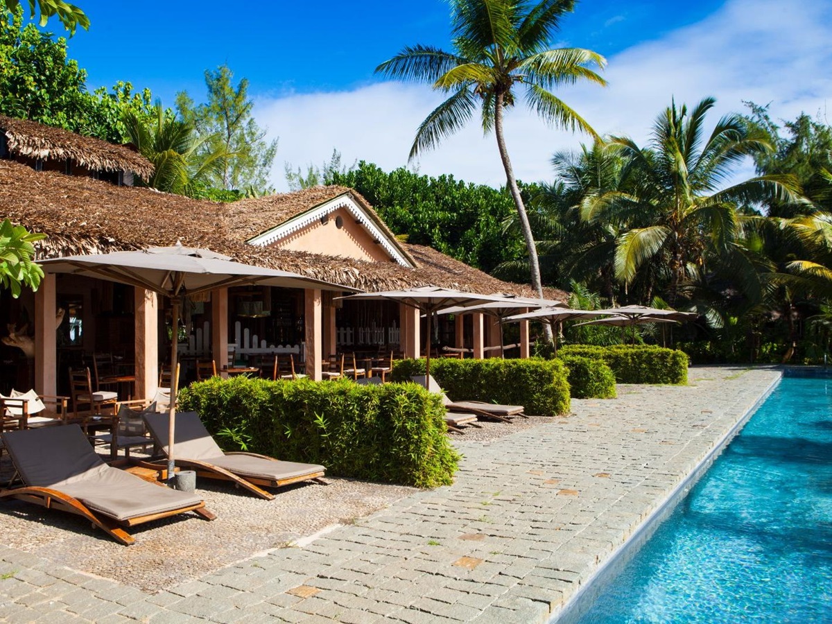 Poolside building and loungers at Princesse Bora Lodge & Spa on Sainte-Marie Island in Madagascar