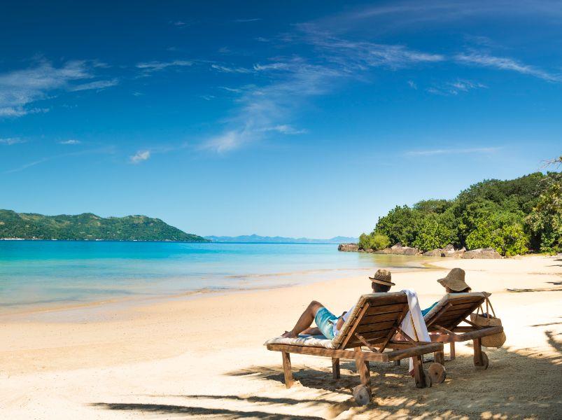 Loungers on the beach at Tsara Komba in the Nosy Be archipelago in Madagascar