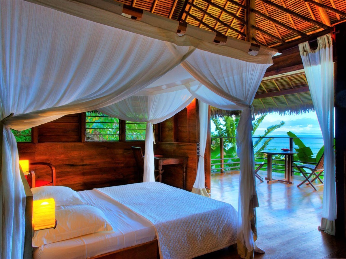 Guest bedroom with ocean views at Tsara Komba in the Nosy Be archipelago in Madagascar