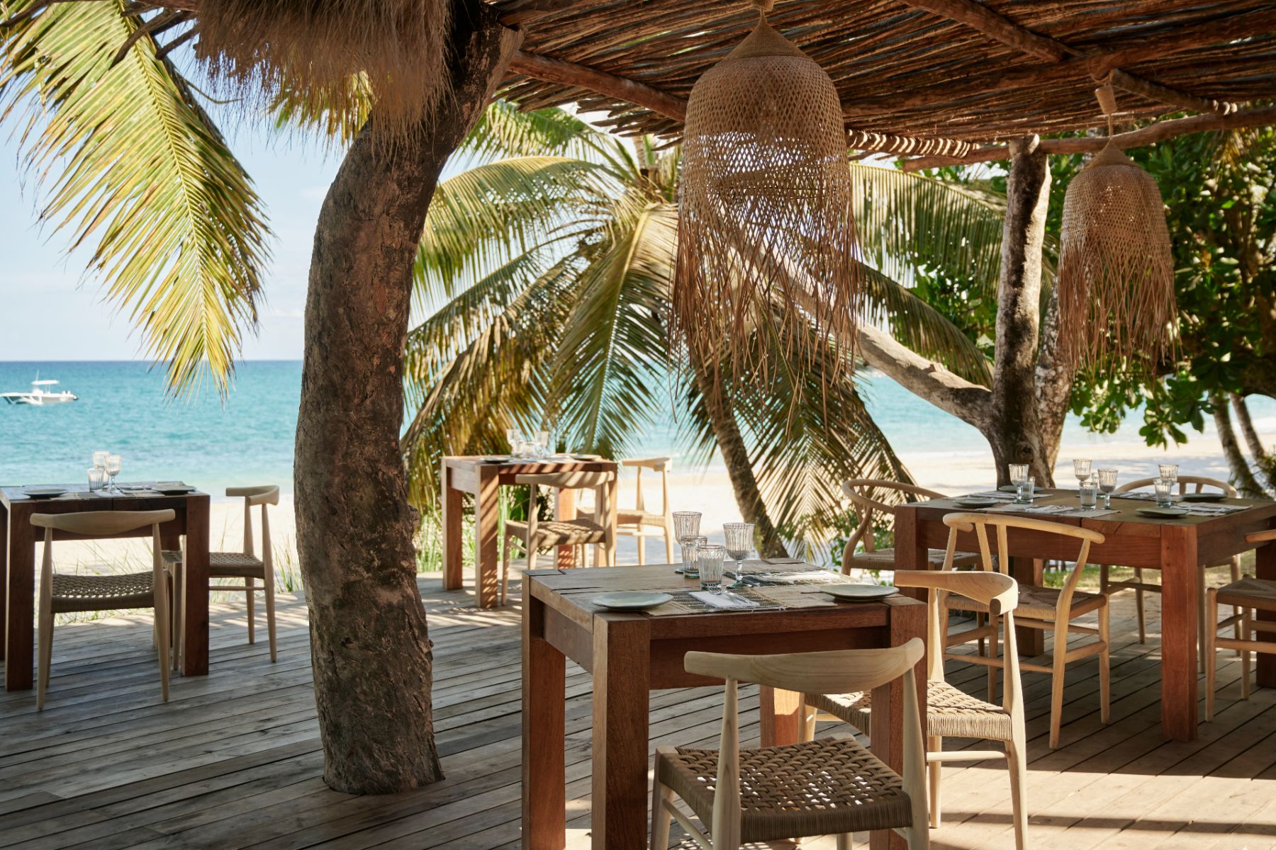 Seating with sea views at the La Plage Restaurant at Voaara luxury resort in Madagascar