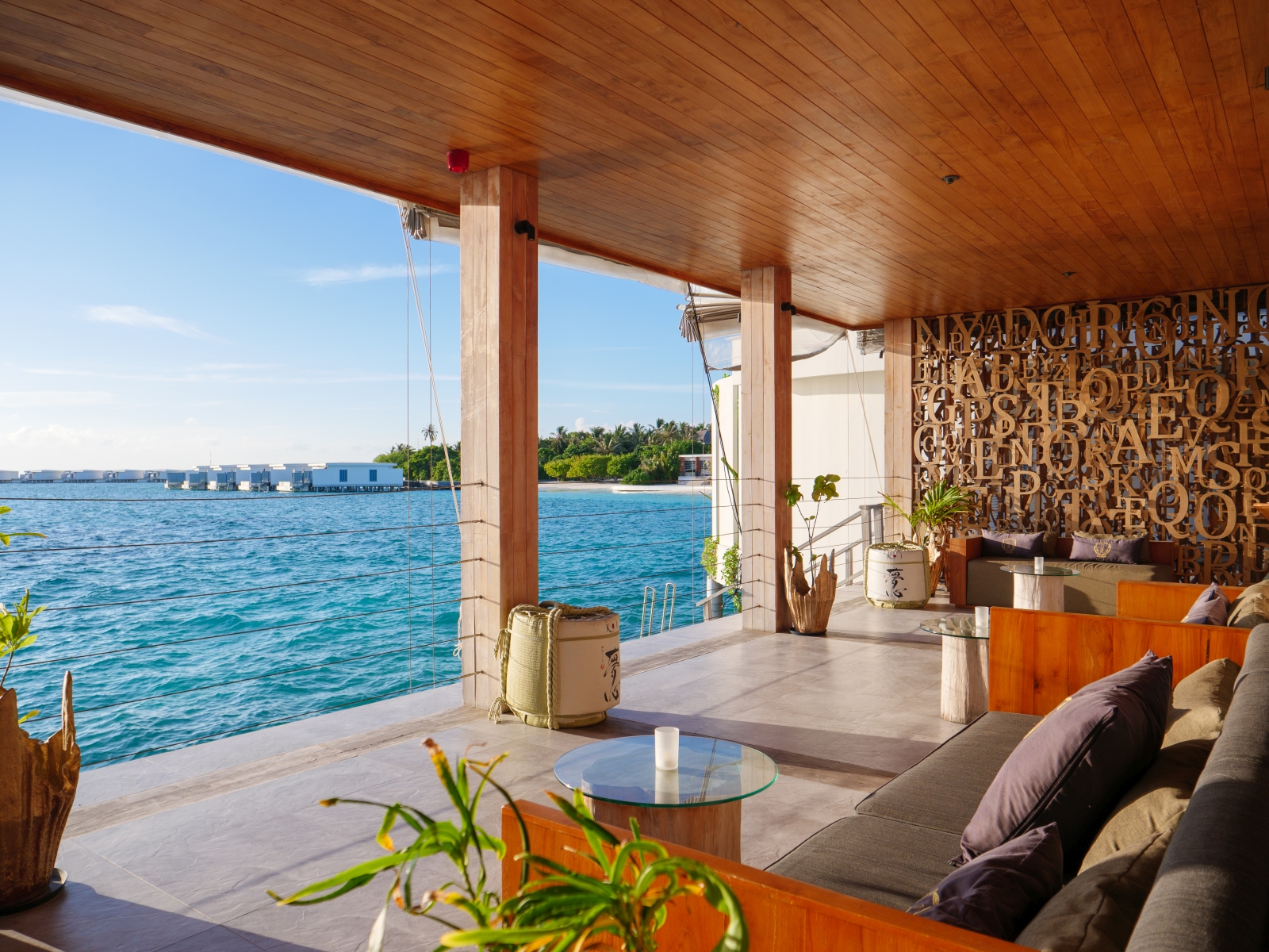 Sea-side terrace at OAK Lounge at luxury resort Amilla in the Maldives