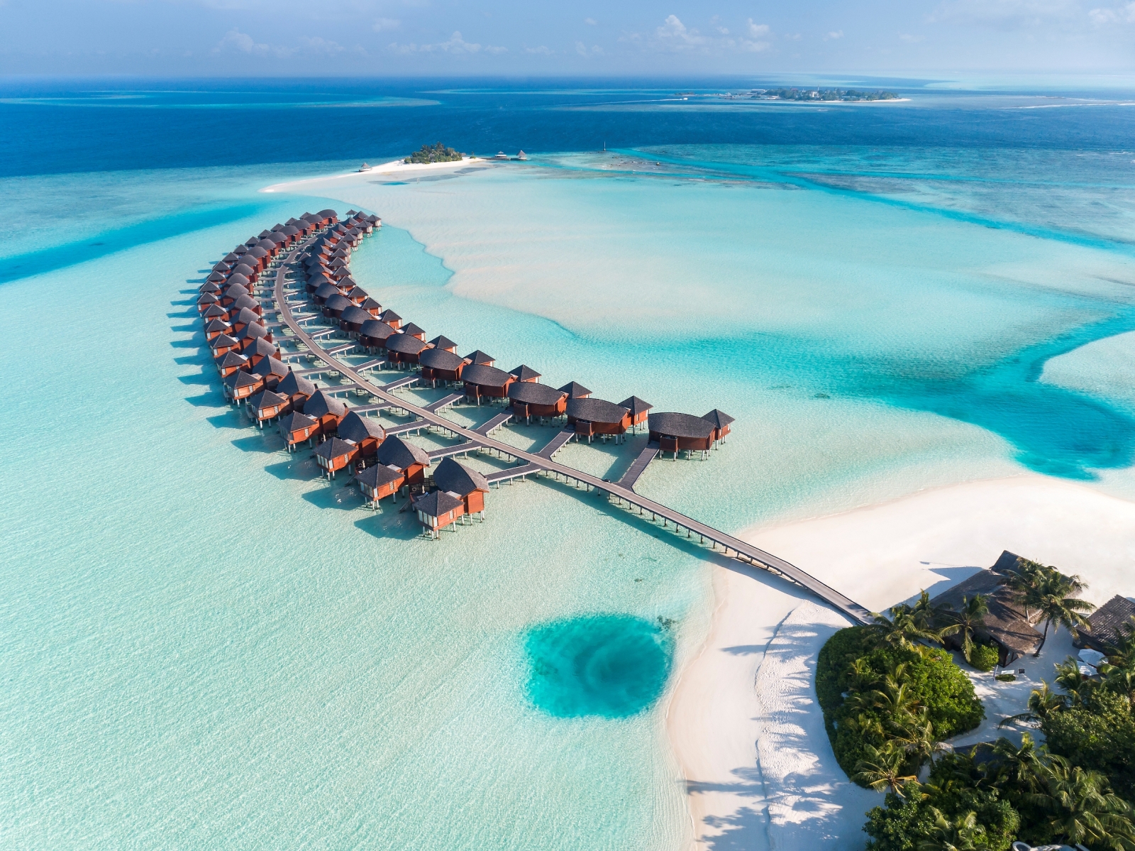 Aerial view of Water villas at luxury resort Anantara Dhigu in the Maldives